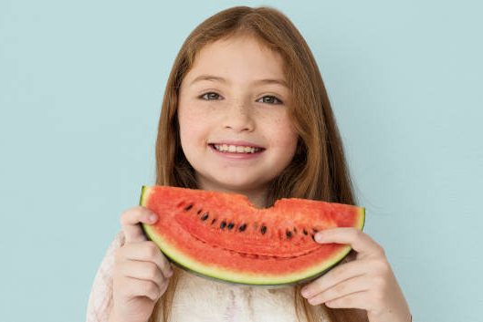 child eating watermelon child eating watermelon